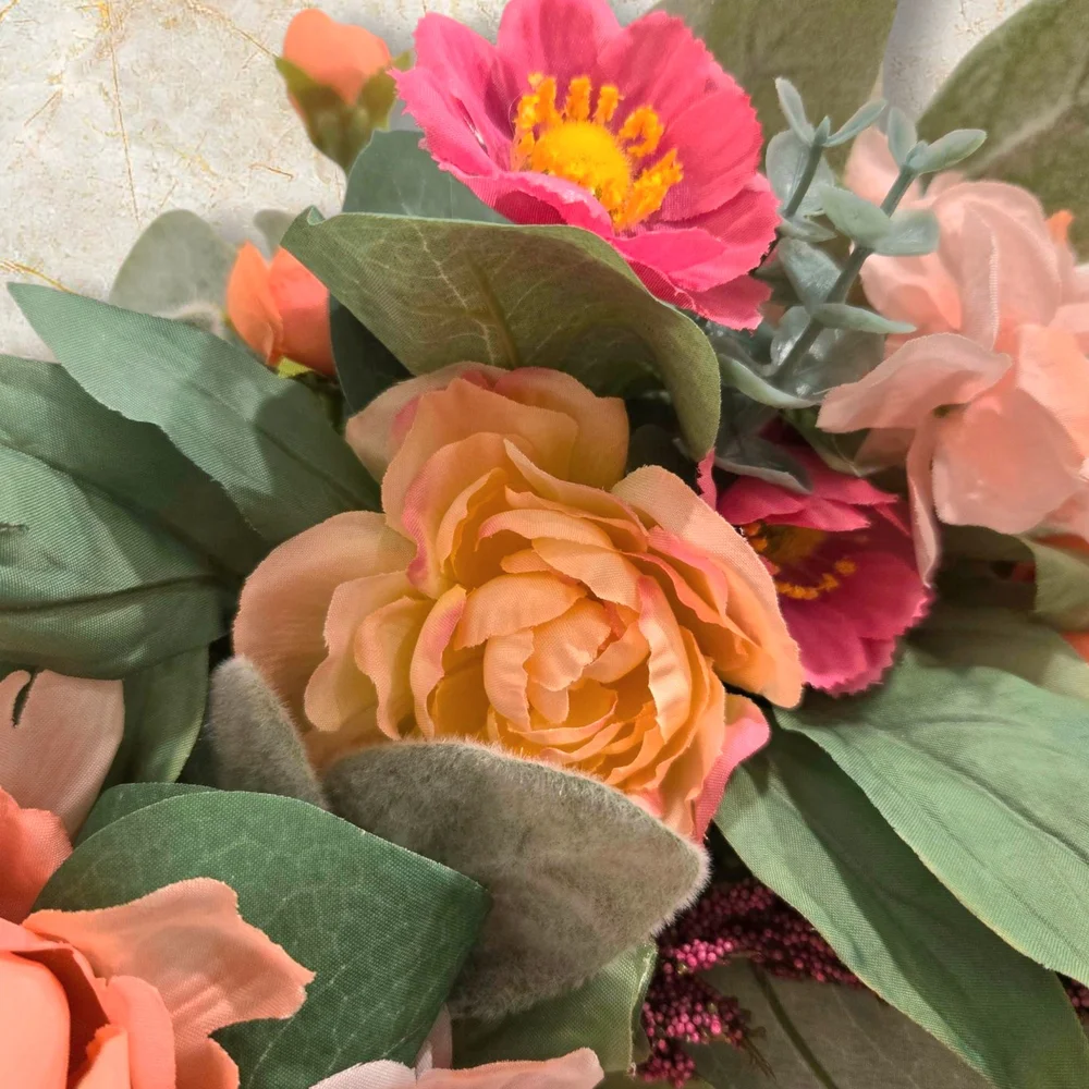 Peach and Pink Holiday Wreath with Festive Ribbon